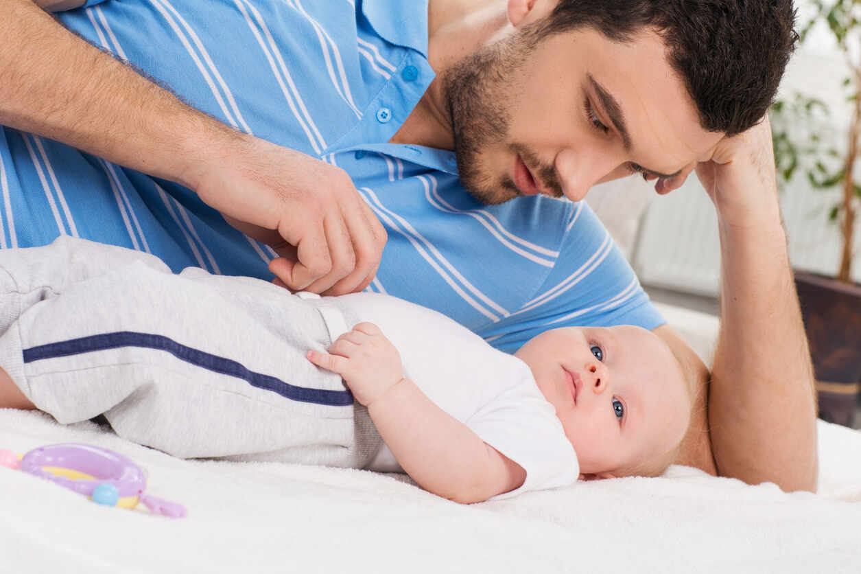 Father looking at his baby, symbolizing paternity and family law in Florida.